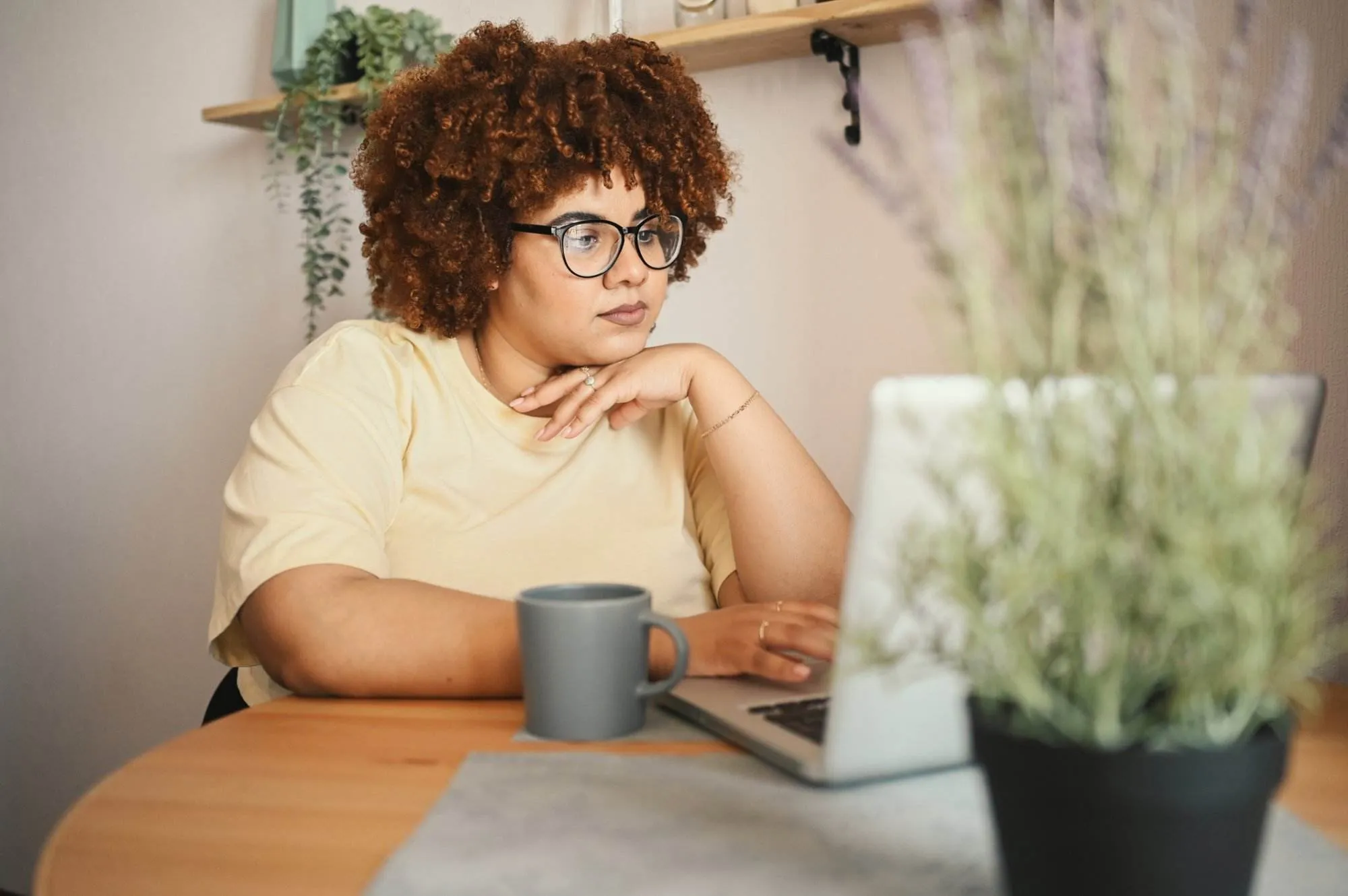 Woman building a landing page on a laptop.